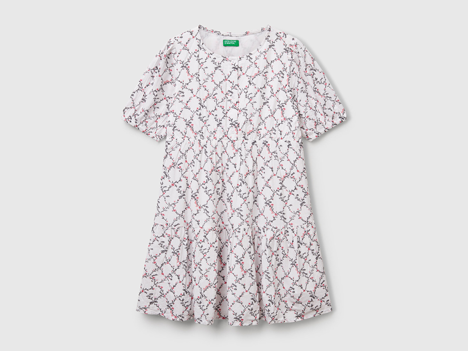 Benetton Kız Çocuk Beyaz Mix Viskozlu Desenli Önü Düğmeli Pileli Katlı Kısa Kollu Elbise