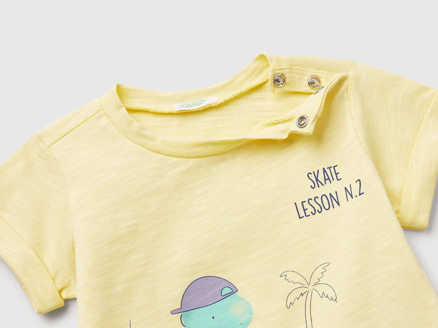 Benetton Bebek Sarı Önü Baskılı Omzu Çıtçıtlı Manşet Detaylı T-Shirt