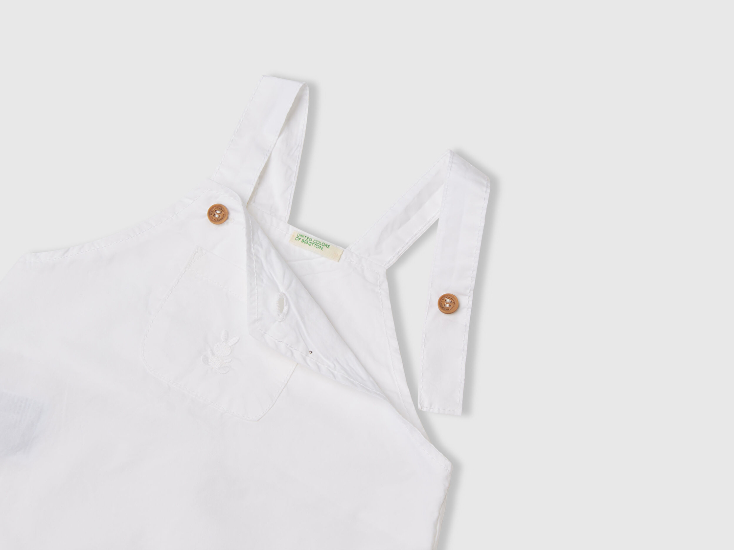Benetton Bebek Beyaz Cebi Tavşan Logosu İşlemeli Lastikli Askılı Poplin Tulum