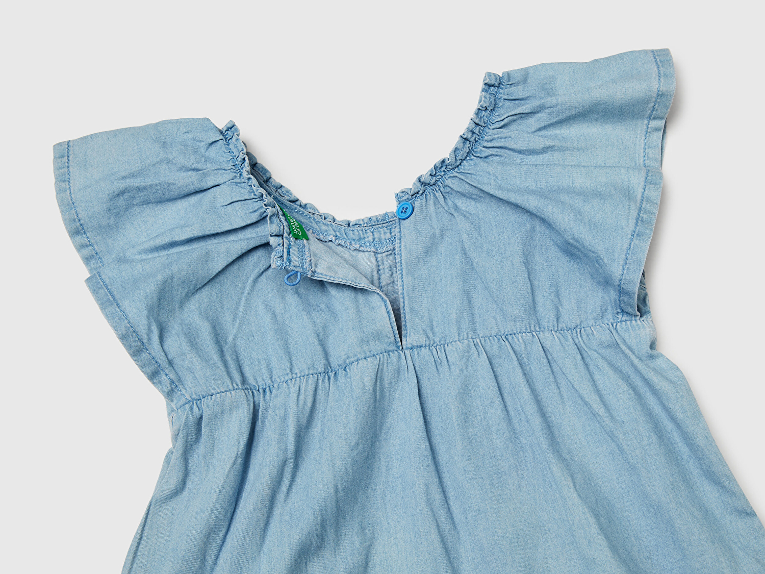 Benetton Kız Bebek Denim Yakası Lastikli Kolu ve Eteği Fırfırlı Hafif Bol Kesim Şönil Elbise