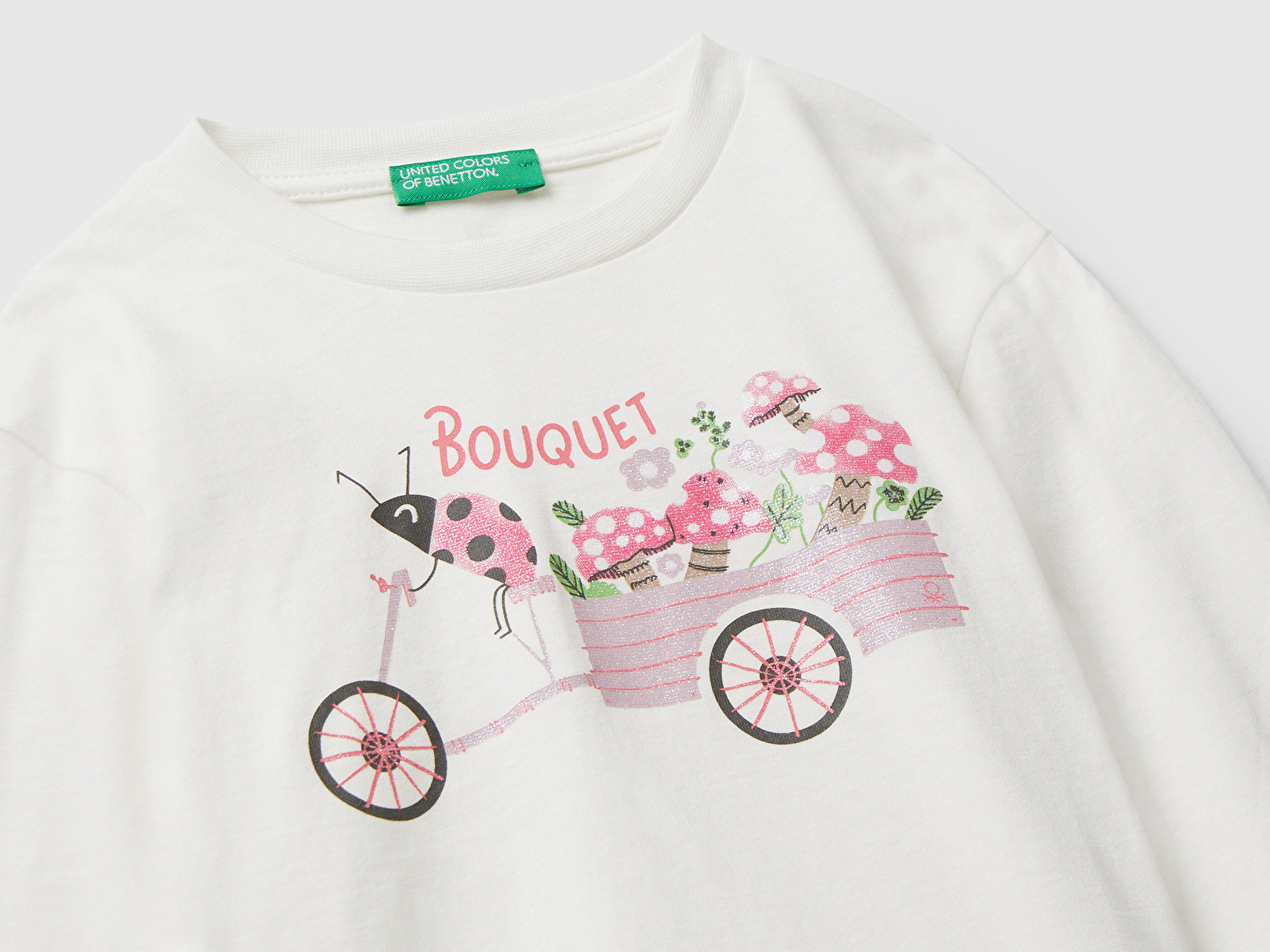 Benetton Kız Bebek Ekru Önü Parıltılı Baskılı Bisiklet Yaka Uzun Kollu T-shirt