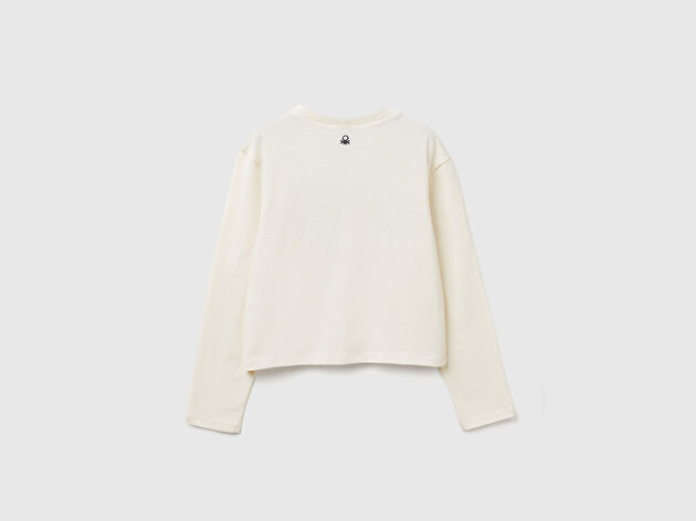 Benetton Kız Çocuk Ekru Önü Simli Baskılı Logo Etiketli Boxy Uzun Kollu T-shirt